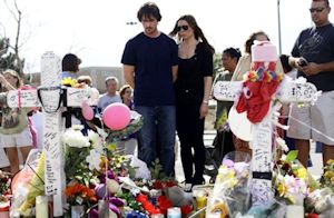 Christian Bale visiting memorial at Aurora