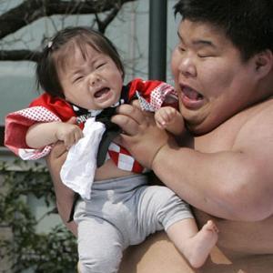 fat man with crying baby