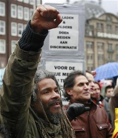 This demonstrator in Amsterdam, protesting Wilders and his film, is arguing in the civilized manner--without a gun--and I applaud him for it