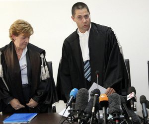 Marco Billi (right) reads the verdict