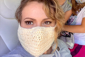 Alyssa Milano wearing a crocheted mask