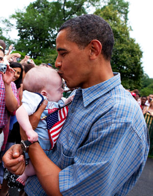 Obama kissing a baby and the American flag