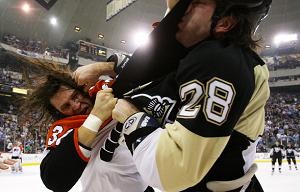 Pittsburgh Penguin fighting a Philadelphia Flyer