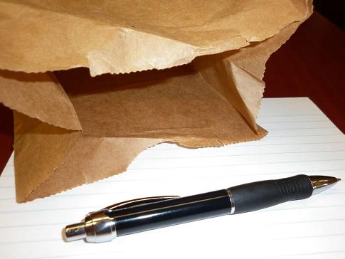 A paper bag and a pen