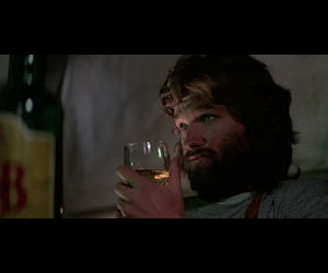 At the end of The Thing (1982) when MacReady and Childs were sitting down when the camp was burning down, was one of them infected? Was it convenient for the “Thing” because